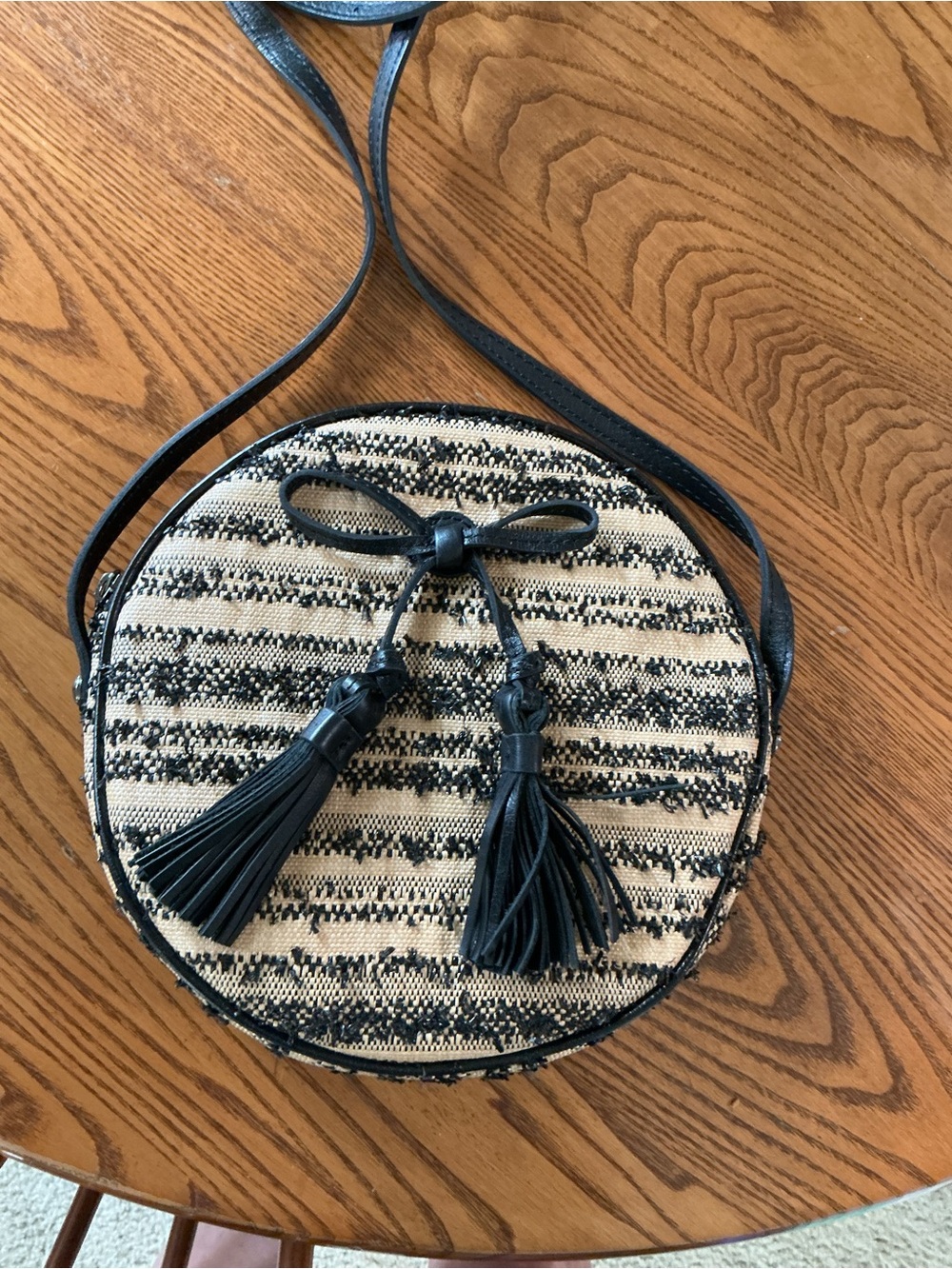 Patricia Nash Black and Beige Woven Round Crossbody with Tassels